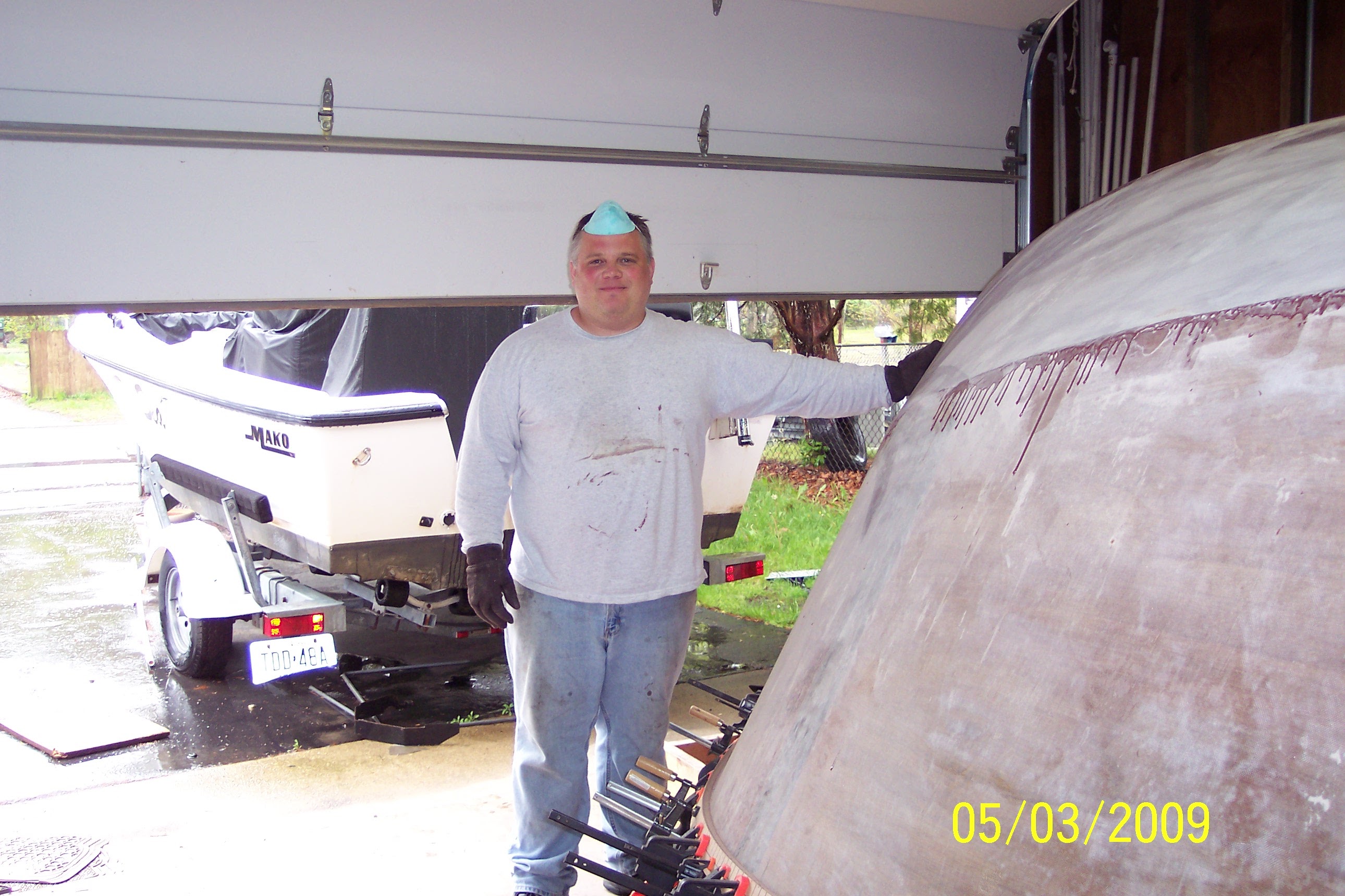 Lane standing next to hull outside, May 2009