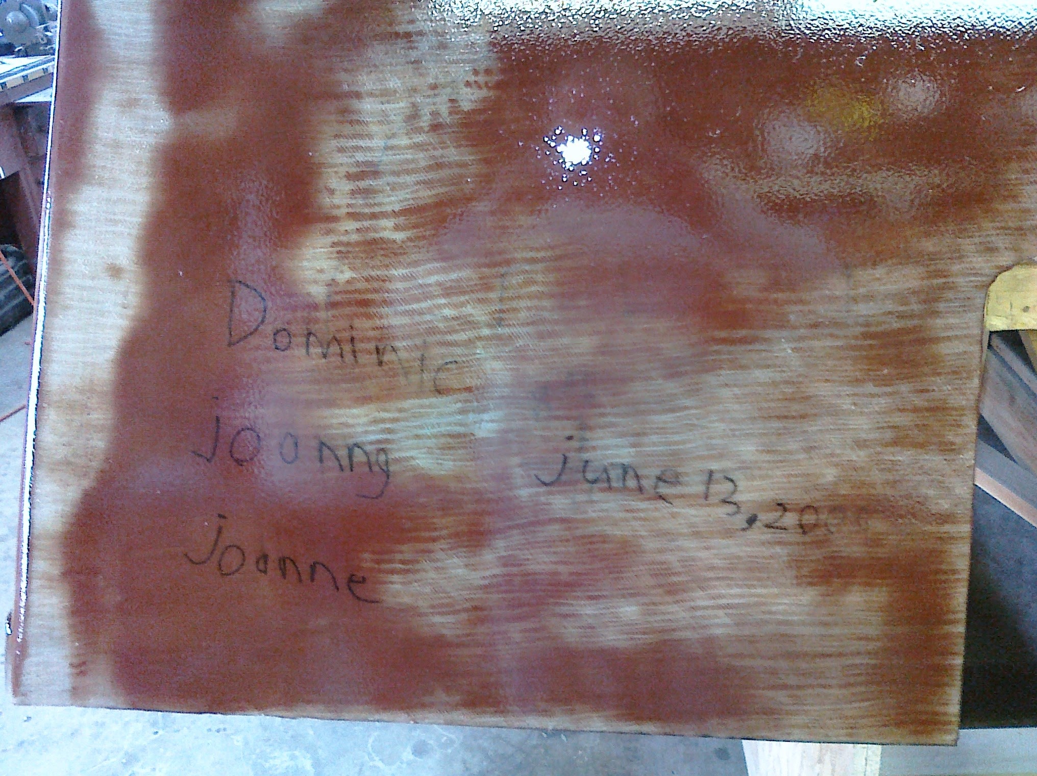 Family names written on wood before glassing