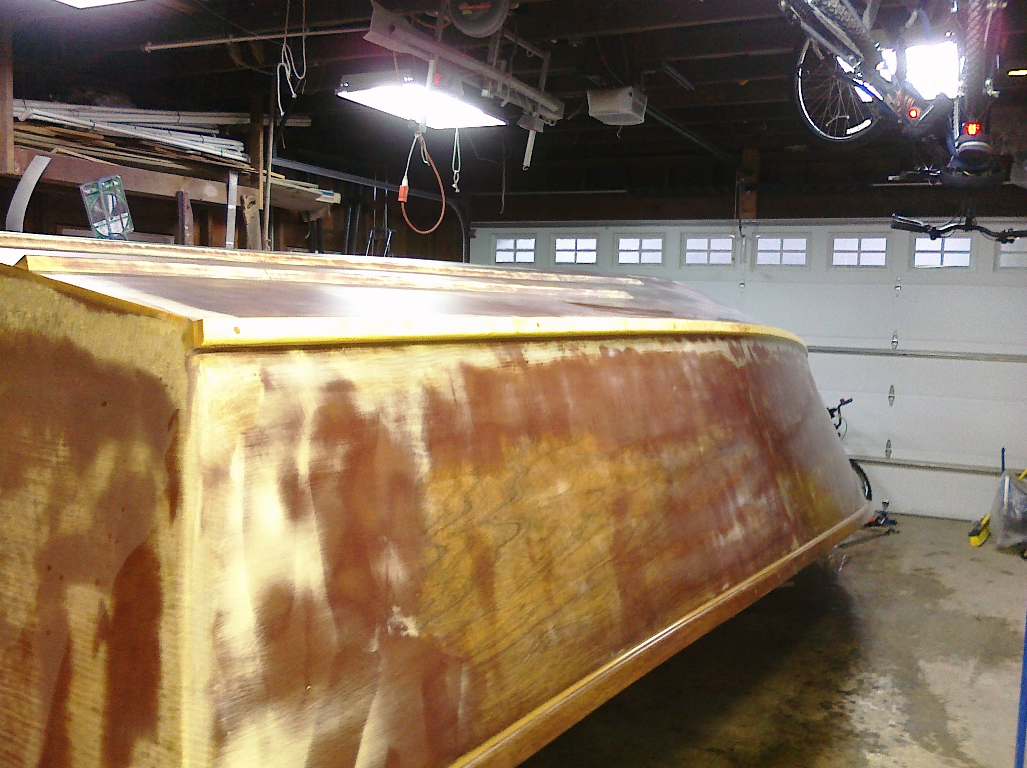 Hull with epoxy work continuing