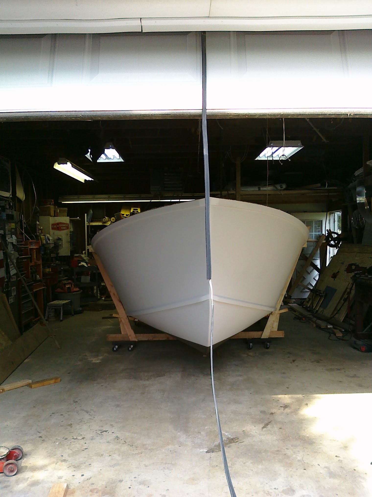 White hull upright on rolling cradle
