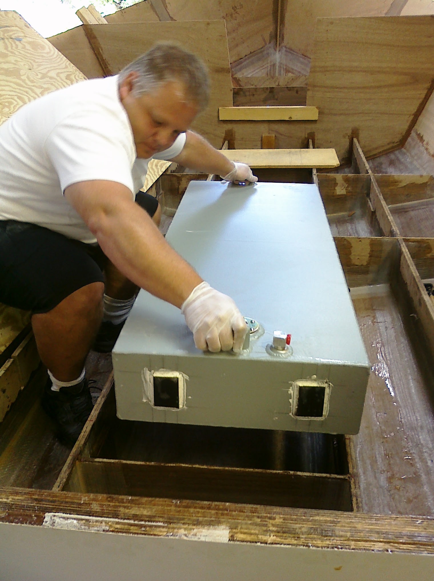 Lane installing the fuel tank