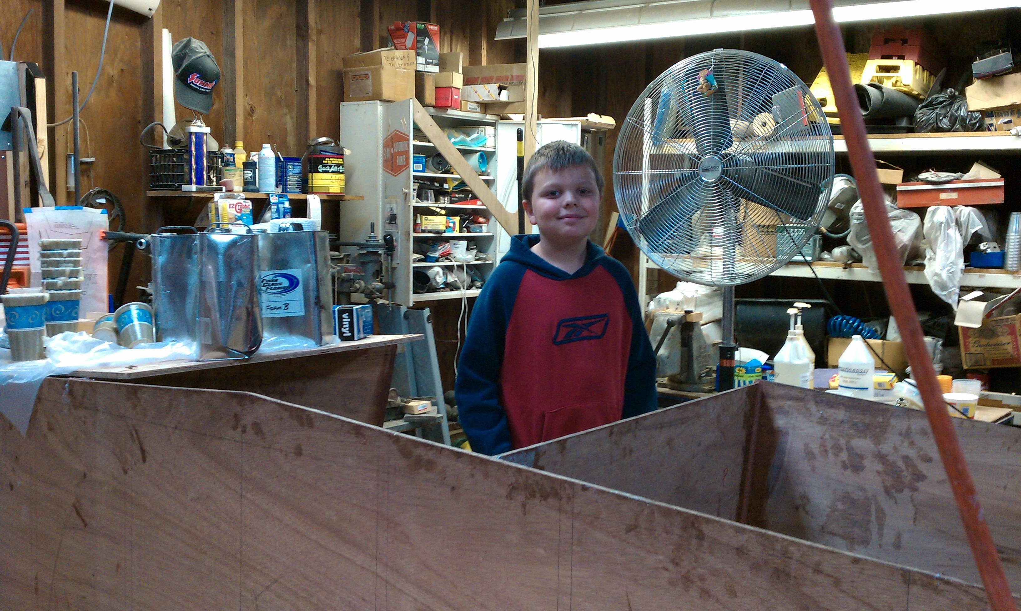 Young Dominic standing in the hull during build