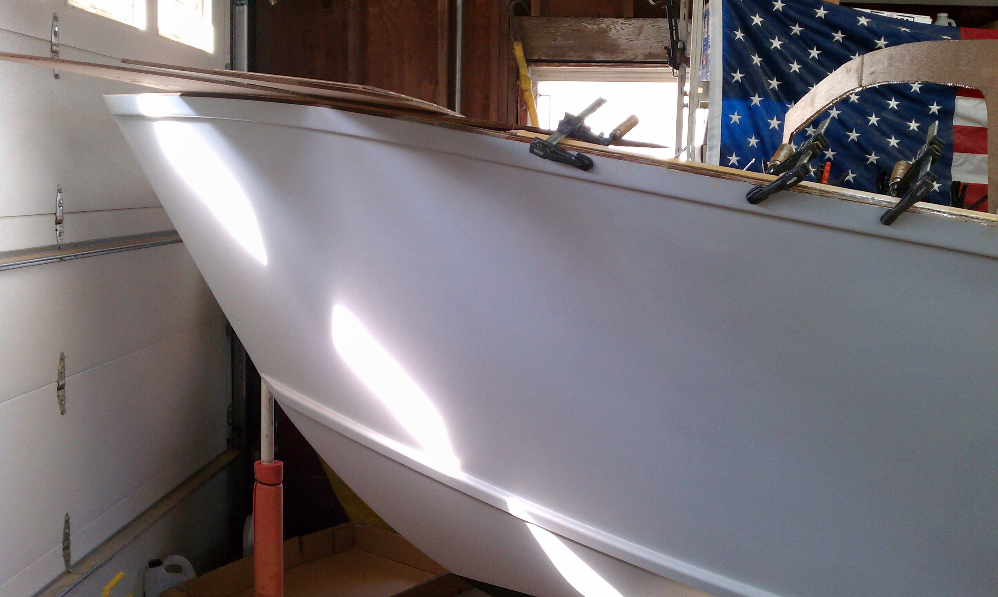 White hull with beautiful curves and American flag