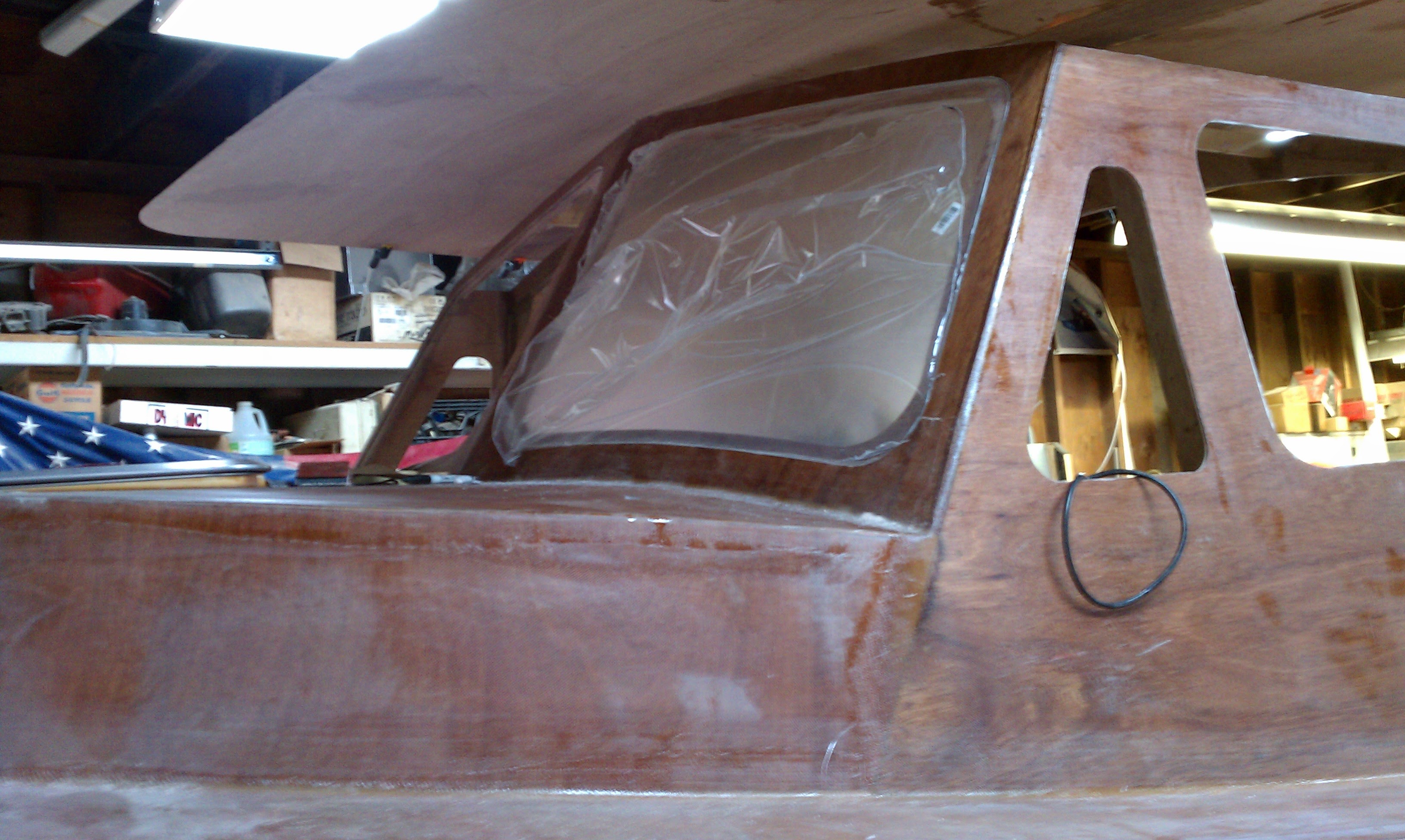 Cabin windshield and window frames raw wood