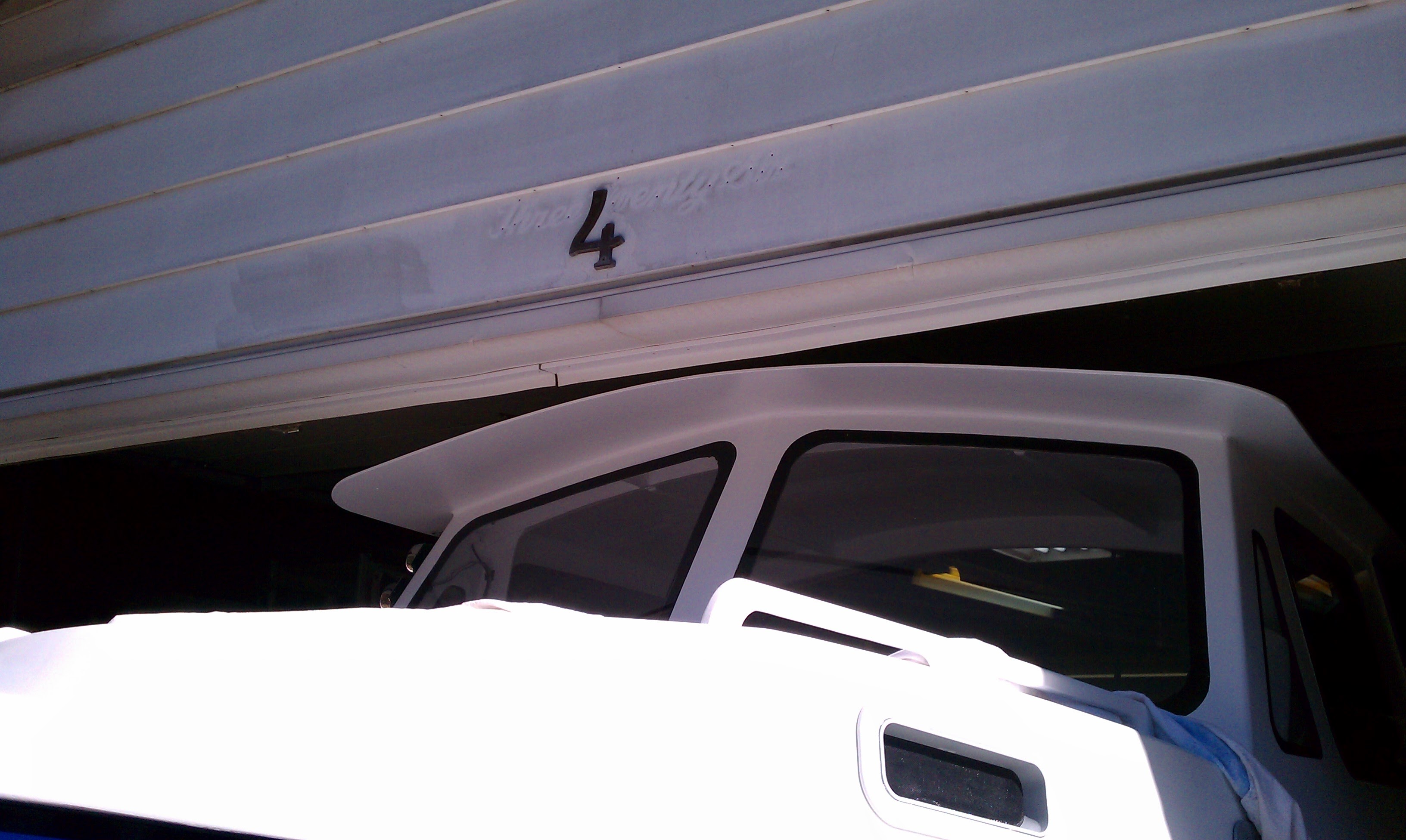 The J-Marie cabin top clearing the garage door opening by inches