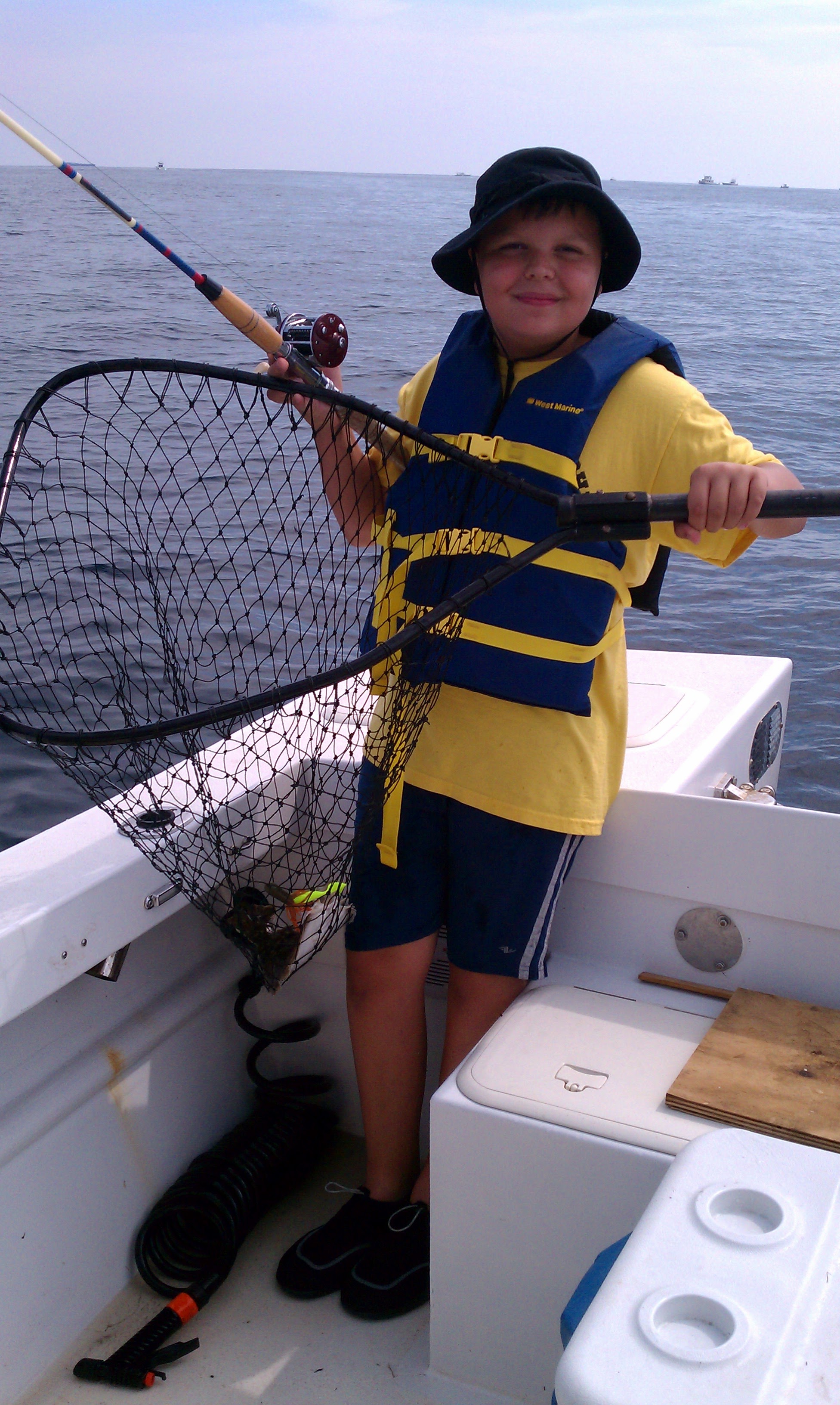Young Dominic on J-Marie fishing with net