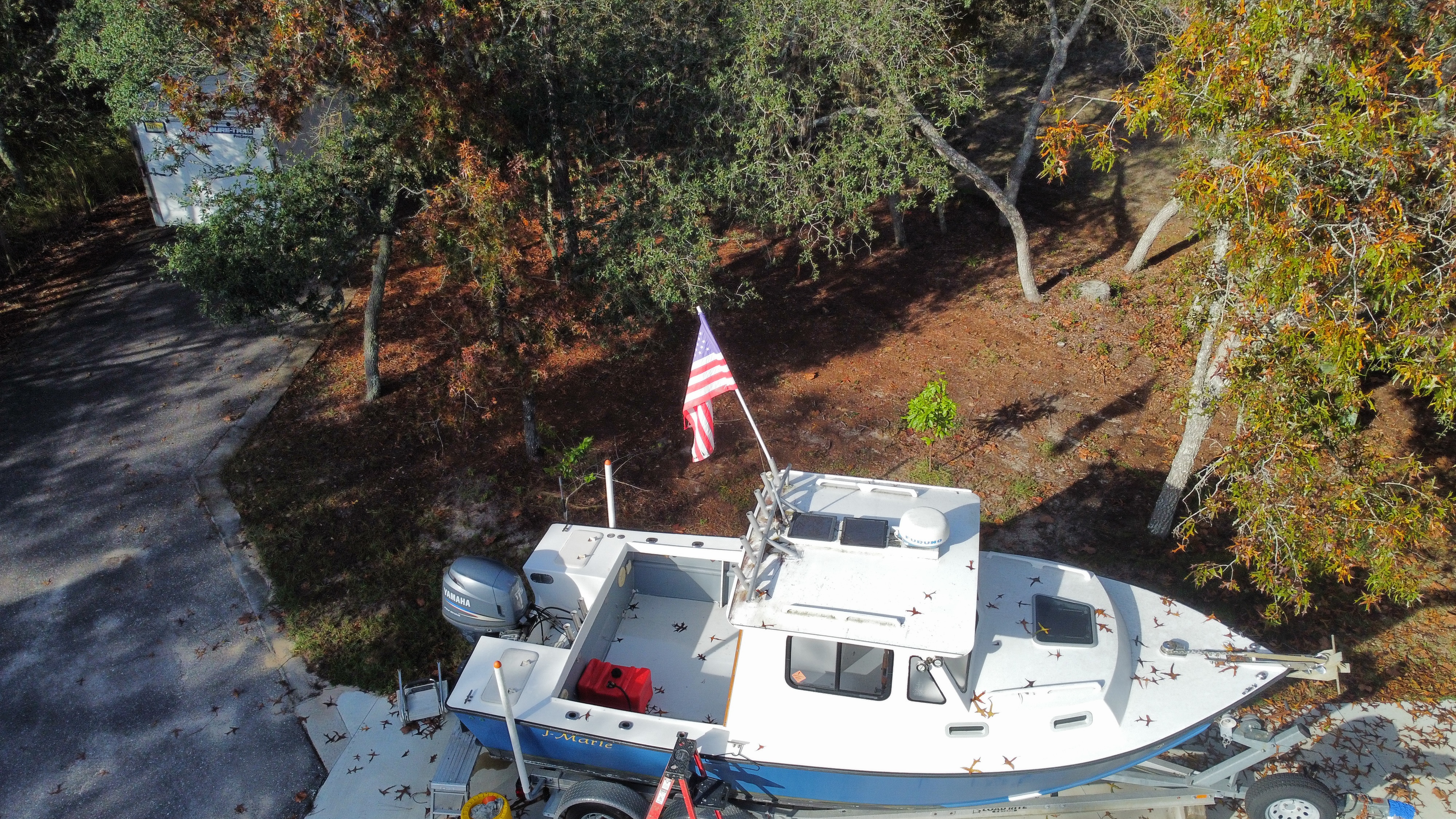 Aerial drone shot of J-Marie on trailer with American flag