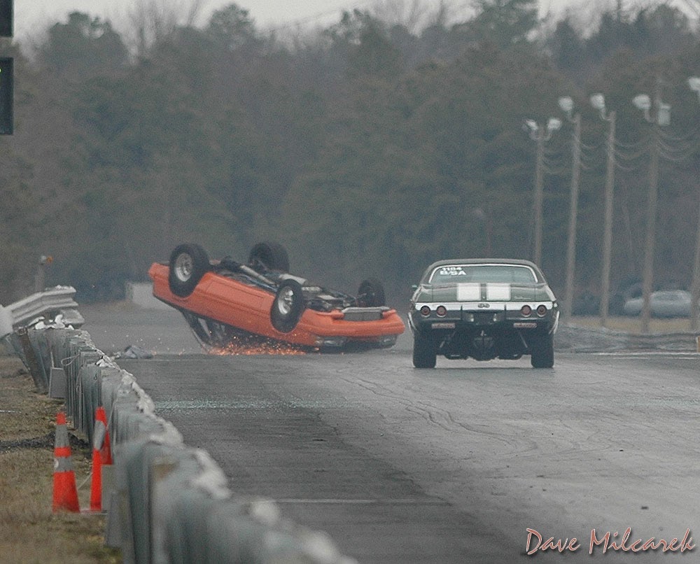 Car sliding inverted down the track