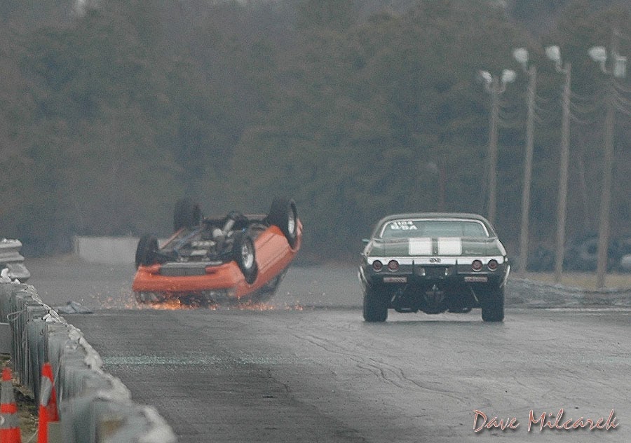 Car still inverted, further down the track