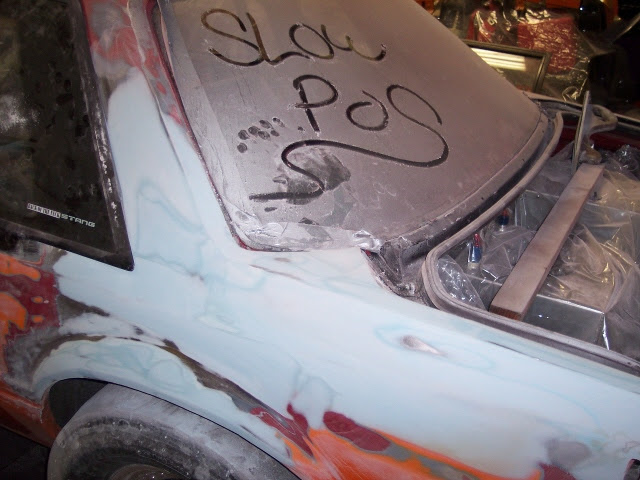 Mid-rebuild with Slow POS written on the windshield
