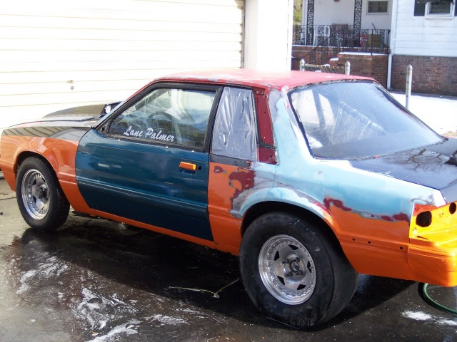 Mid-rebuild, mismatched panels, Lane Palmer on window