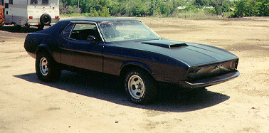 1973 Mustang Grande in primer during bodywork